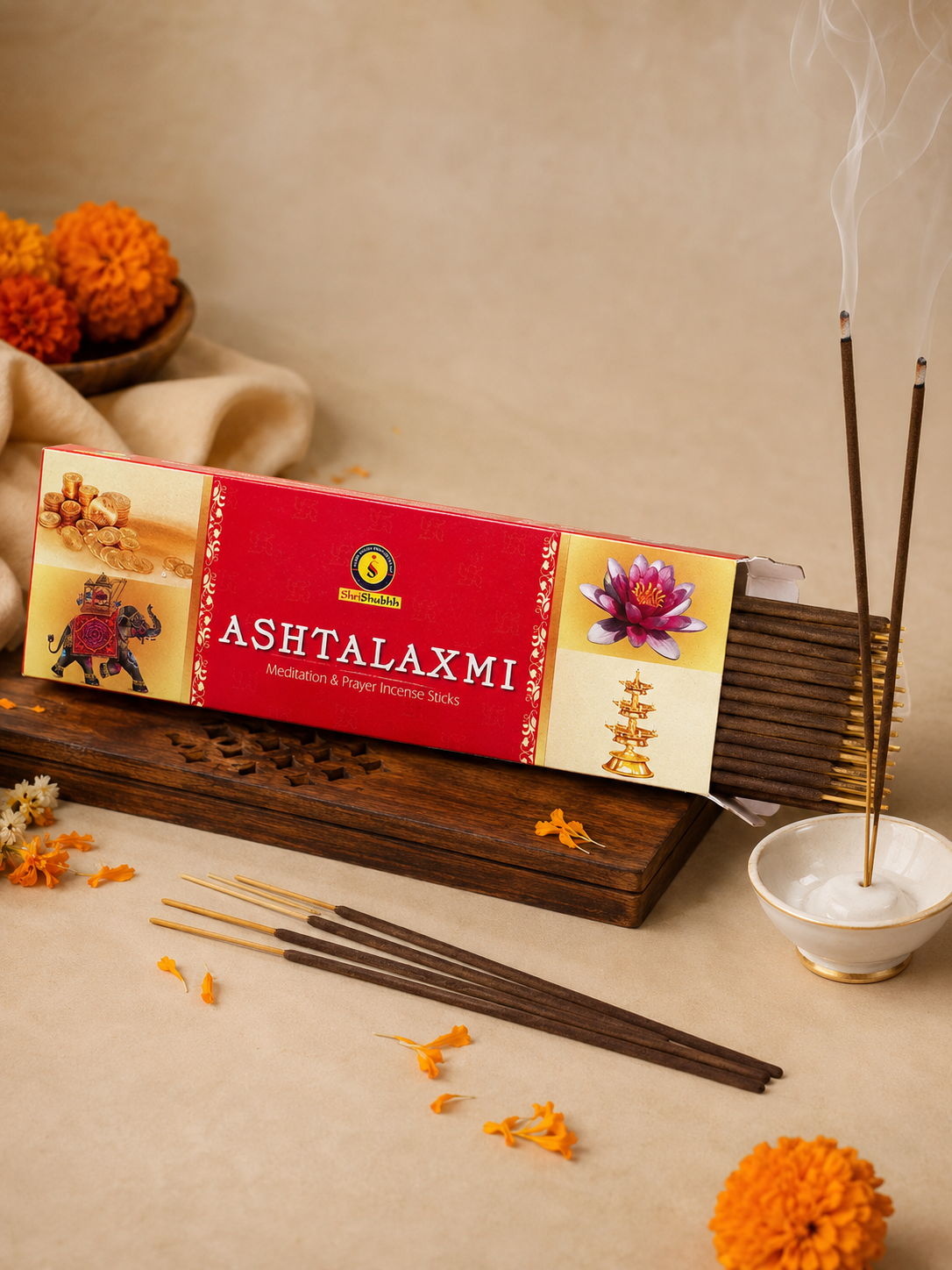 Ashtalaxmi incense packaging with incense sticks and marigold flowers on a beige background
